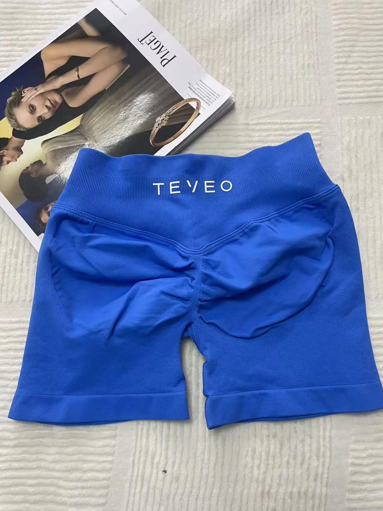 blue soft, breathable yoga shorts in a high-waisted fit—perfect for workouts, yoga, or relaxed summer days.