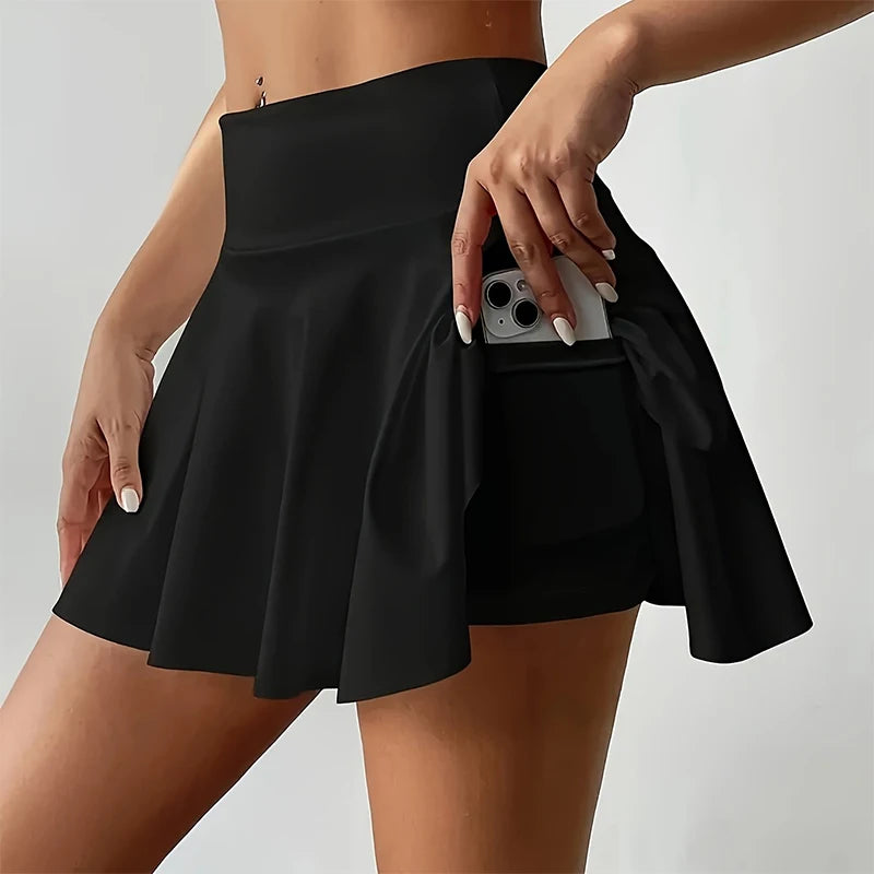 Woman wearing white high-waist skort with hidden pocket and built-in shorts