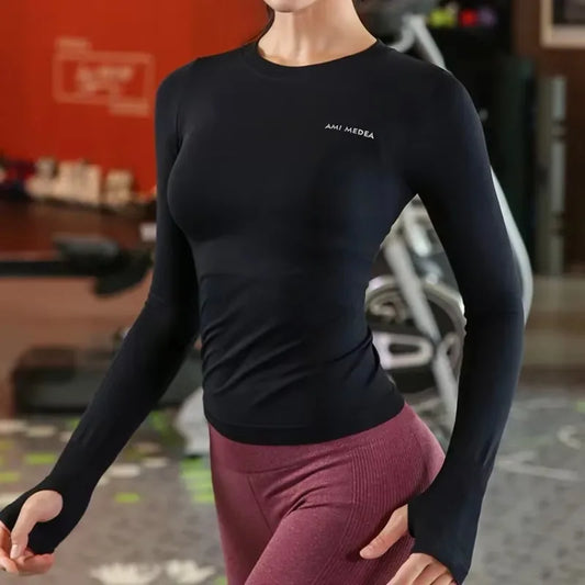 Woman wearing a slim-fit long sleeve yoga shirt during a light workout