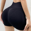 Woman wearing high waist workout shorts during a summer workout