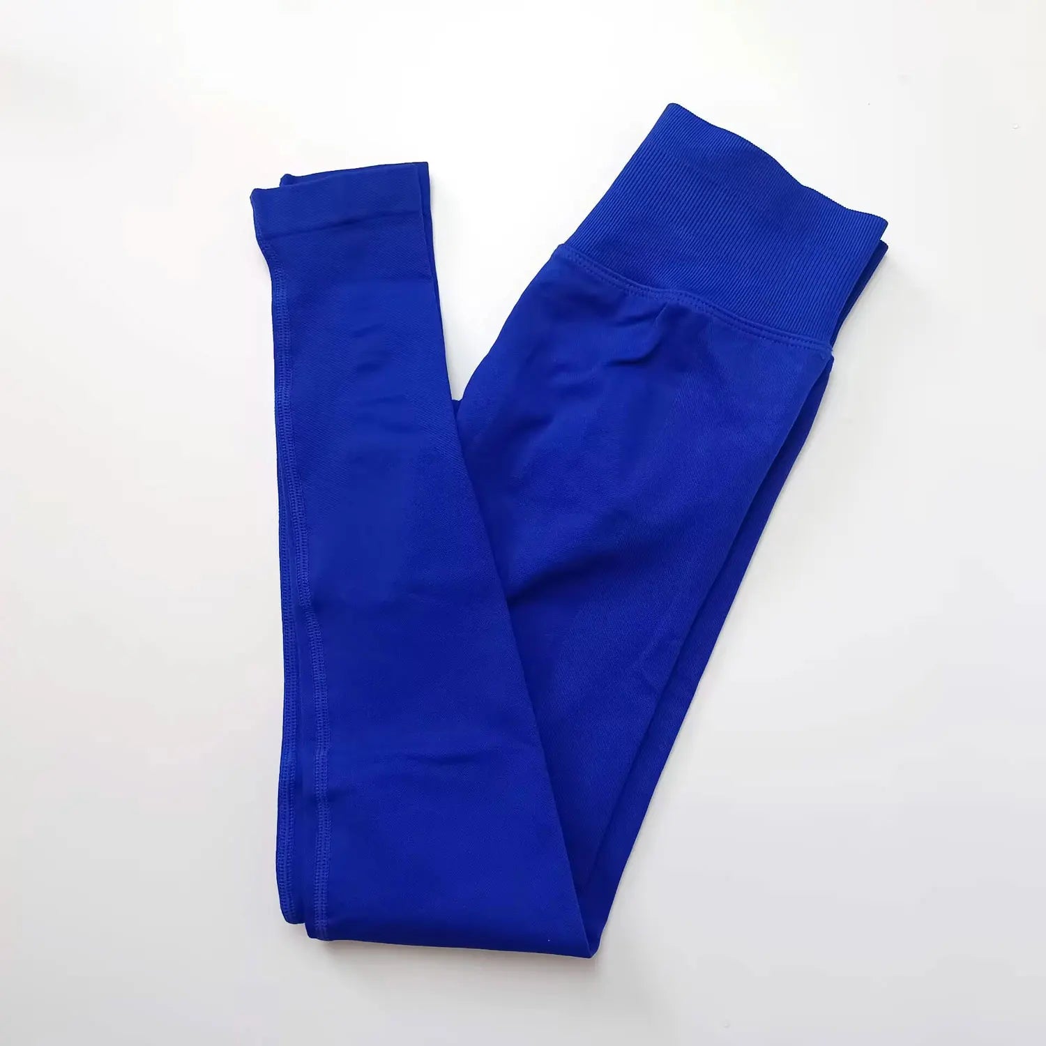 Woman wearing blue seamless gym leggings with high waist tummy control fit