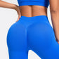 Woman wearing blue seamless gym leggings with high waist tummy control fit