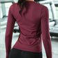 Woman wearing a slim-fit long sleeve yoga shirt during a light workout