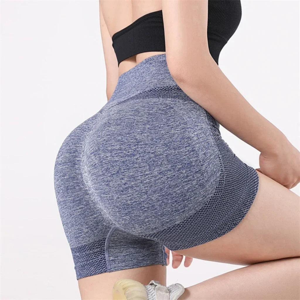 Woman wearing high waist workout shorts during a summer workout
