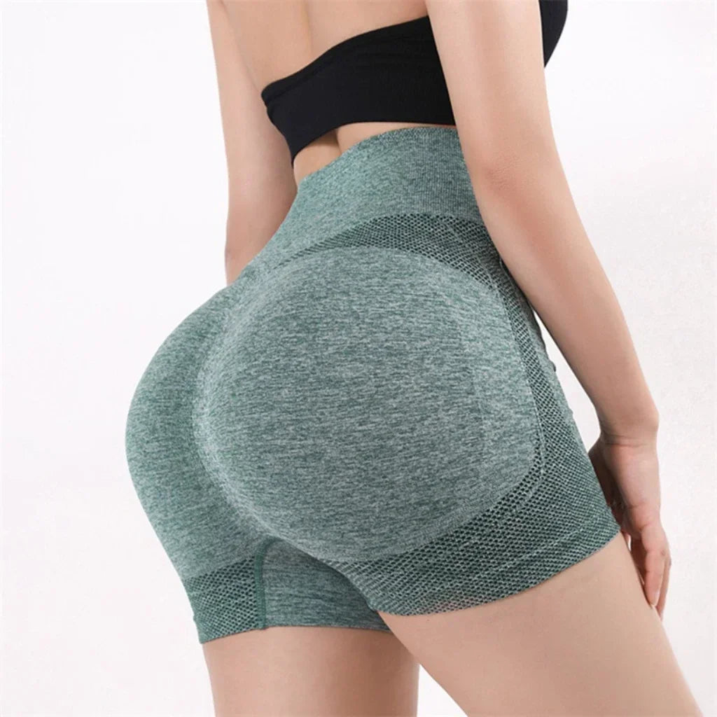 Woman wearing high waist workout shorts during a summer workout