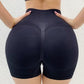 Woman wearing high waist workout shorts during a summer workout