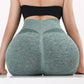 Woman wearing high waist workout shorts during a summer workout