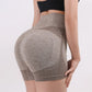 Woman wearing high waist workout shorts during a summer workout
