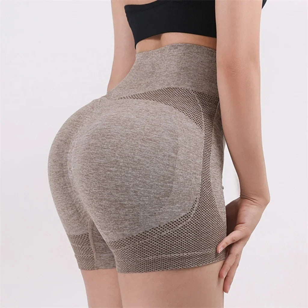 Woman wearing high waist workout shorts during a summer workout