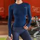 Woman wearing a slim-fit long sleeve yoga shirt during a light workout
